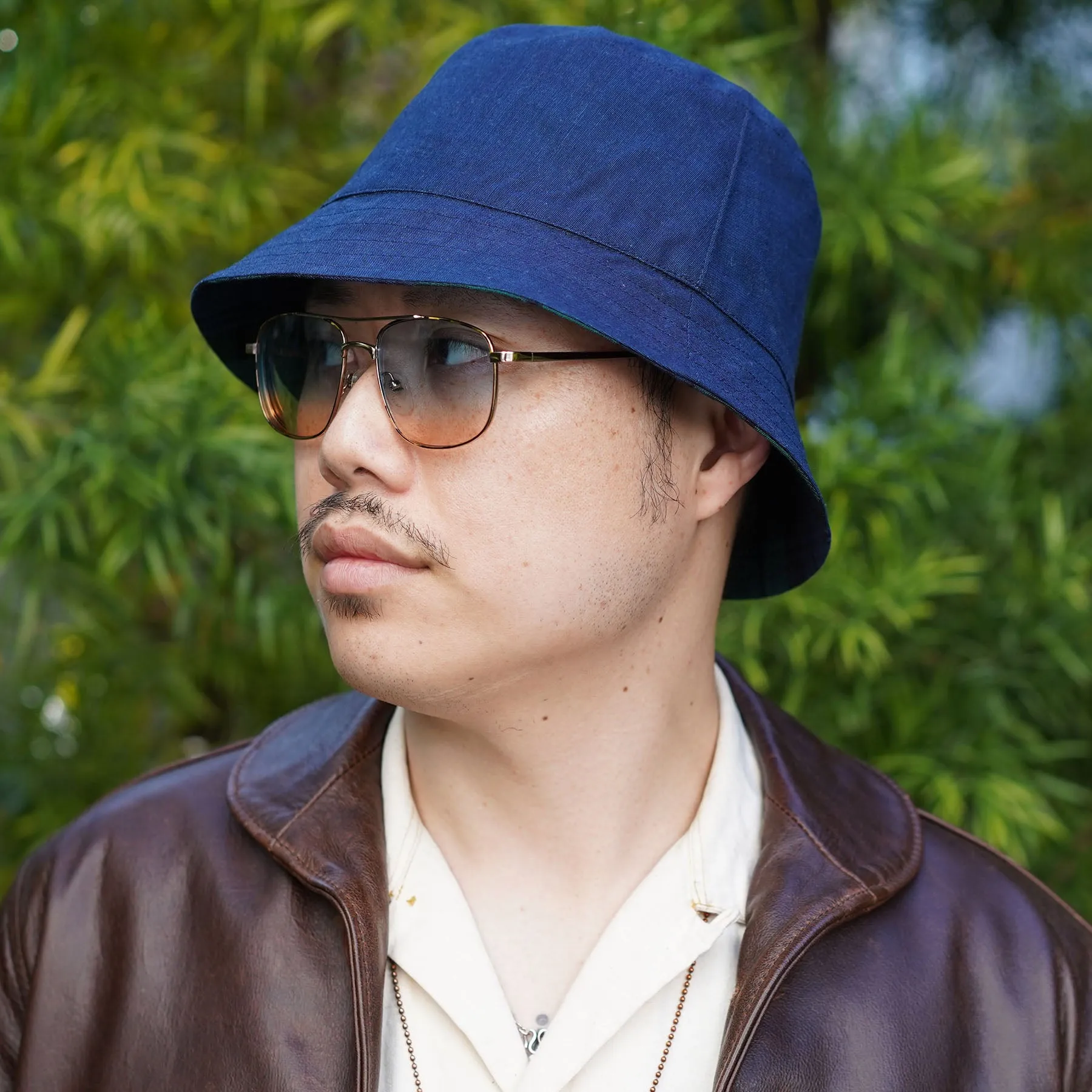 Joyride Reversible Bucket Hat in E. Thomas Black Watch Plaid Wool/Orta Anadolu Deep Indigo Chambray